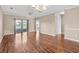 Living room with hardwood floors, water views, and sliding glass doors at 336 Kiskadee Loop # B, Conway, SC 29526