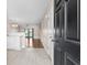 Bright entryway with kitchen and living room views, hardwood floors, and neutral walls at 336 Kiskadee Loop # B, Conway, SC 29526