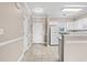 Kitchen features white cabinets, tile flooring, and a breakfast bar at 336 Kiskadee Loop # B, Conway, SC 29526