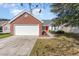 Brick ranch home with attached garage and red door at 419 Mckendree Ln., Myrtle Beach, SC 29579