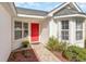 Welcoming entryway with red door and bay window at 419 Mckendree Ln., Myrtle Beach, SC 29579