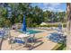 Community pool with lounge chairs and umbrellas at 419 Mckendree Ln., Myrtle Beach, SC 29579