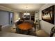 Bright dining area with a table and chairs near the living room at 311 69Th Ave. N # 104, Myrtle Beach, SC 29572