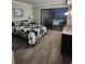Spacious bedroom with a king-size bed and sliding glass doors leading to a balcony at 311 69Th Ave. N # 104, Myrtle Beach, SC 29572