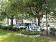 Sea Mark Tower building exterior with lush landscaping and ample parking at 311 69Th Ave. N # 104, Myrtle Beach, SC 29572