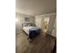 Bedroom with a queen-size bed and access to a bathroom at 311 69Th Ave. N # 104, Myrtle Beach, SC 29572