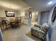 Charming dining area with round table and chairs, adjacent to kitchen at 311 69Th Ave. N # 104, Myrtle Beach, SC 29572