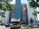 High rise building exterior, featuring blue and white color scheme and ample parking at 311 69Th Ave. N # 104, Myrtle Beach, SC 29572