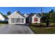 House exterior featuring a two-car garage and landscaping at 196 Marsh Hawk Dr., Myrtle Beach, SC 29588