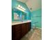 Bathroom with walk-in shower, modern vanity, and soothing teal walls at 196 Marsh Hawk Dr., Myrtle Beach, SC 29588