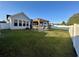 Spacious backyard with a pergola-covered patio and grassy lawn at 196 Marsh Hawk Dr., Myrtle Beach, SC 29588
