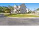 Two story tan house with walkway and lawn at 154 Terracina Circle, Myrtle Beach, SC 29588