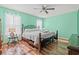 Spacious bedroom with light walls, ceiling fan, and a queen bed at 154 Terracina Circle, Myrtle Beach, SC 29588