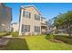 Two-story tan house with a landscaped yard at 154 Terracina Circle, Myrtle Beach, SC 29588
