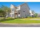 Two story tan house with walkway and lawn at 154 Terracina Circle, Myrtle Beach, SC 29588