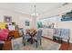 Casual dining area with glass table, four chairs, and access to living room at 154 Terracina Circle, Myrtle Beach, SC 29588