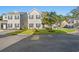 Two-story townhome with landscaping and street view at 154 Terracina Circle, Myrtle Beach, SC 29588