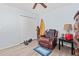 Bedroom with leather recliner, dresser, and surfboard at 154 Terracina Circle, Myrtle Beach, SC 29588