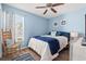 Bedroom with wooden chair and blue bedding at 154 Terracina Circle, Myrtle Beach, SC 29588