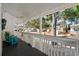 Covered porch with ceiling fan and seating at 6001-7038 S Kings Hwy., Myrtle Beach, SC 29575