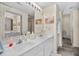 Double vanity bathroom with a large mirror at 6001-7038 S Kings Hwy., Myrtle Beach, SC 29575