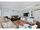 Bright living room with brown leather couches and coastal decor at 6001-7038 S Kings Hwy., Myrtle Beach, SC 29575