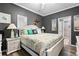 Bright bedroom with a queen-size bed and ensuite bathroom access at 6001-7038 S Kings Hwy., Myrtle Beach, SC 29575