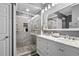 Elegant bathroom with double vanity, large mirror, and a walk-in shower at 6001-7038 S Kings Hwy., Myrtle Beach, SC 29575