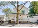 Two-story home with front porch and large tree in front at 6001-7038 S Kings Hwy., Myrtle Beach, SC 29575