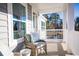 Relaxing porch with wicker chairs and view of woods at 5063 Selene Ct., Myrtle Beach, SC 29588
