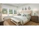 Spacious main bedroom with a king-size bed and large windows at 5063 Selene Ct., Myrtle Beach, SC 29588