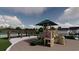 Community playground with playset, shaded area, and pergola at 5063 Selene Ct., Myrtle Beach, SC 29588