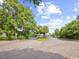 Gated entrance to community with palm trees and landscaping at 14290 Ocean Hwy. # 202, Pawleys Island, SC 29585