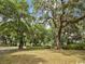 Gated community entrance with lush landscaping and brick pavers at 14290 Ocean Hwy. # 202, Pawleys Island, SC 29585