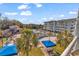 Aerial view of resort pool, landscaping and building at 14290 Ocean Hwy. # 202, Pawleys Island, SC 29585