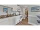 Well-equipped kitchen with white cabinets, granite countertops, and modern appliances at 14290 Ocean Hwy. # 202, Pawleys Island, SC 29585