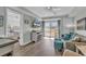 Spacious living room with hardwood floors, comfy seating, and access to balcony at 14290 Ocean Hwy. # 202, Pawleys Island, SC 29585