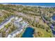 Aerial view showing building, pool, pond, and ocean at 14290 Ocean Hwy. # 202, Pawleys Island, SC 29585