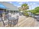 Outdoor patio with tables and chairs near waterway at 14290 Ocean Hwy. # 202, Pawleys Island, SC 29585