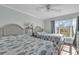 Guest bedroom with two twin beds and a large window at 14290 Ocean Hwy. # 202, Pawleys Island, SC 29585