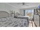 Guest bedroom with two twin beds and a large window at 14290 Ocean Hwy. # 202, Pawleys Island, SC 29585