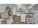Bright kitchen with white cabinets, granite countertops and breakfast bar at 14290 Ocean Hwy. # 202, Pawleys Island, SC 29585