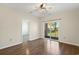 Bright bedroom with wood flooring and private balcony access at 102 Scotch Broom Dr. # B-204, Little River, SC 29566