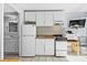 Condo kitchen with white appliances and bathroom access at 1600 S Ocean Blvd. # 346, Myrtle Beach, SC 29577