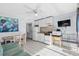 Efficiency condo with white kitchen, appliances, and dining area at 1600 S Ocean Blvd. # 346, Myrtle Beach, SC 29577