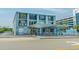 Two-story building with blue accents, ample parking, and gated area at 1600 S Ocean Blvd. # 346, Myrtle Beach, SC 29577