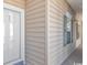 Exterior view of condo building, showing building facade and entrance at 5804 Longwood Dr. # 203, Murrells Inlet, SC 29576