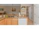 Kitchen features double sinks, light wood cabinets, and a dishwasher at 5804 Longwood Dr. # 203, Murrells Inlet, SC 29576