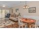 Spacious living room with hardwood floors, and dining area at 5804 Longwood Dr. # 203, Murrells Inlet, SC 29576