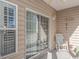 Private porch with rocking chair and sliding glass door at 5804 Longwood Dr. # 203, Murrells Inlet, SC 29576